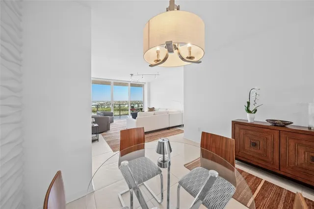 a bed room with a bed and a large window