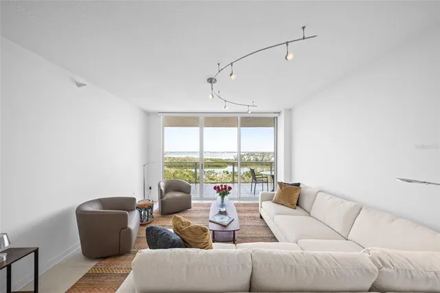 a bathroom with a toilet a sink a mirror a shower and vanity