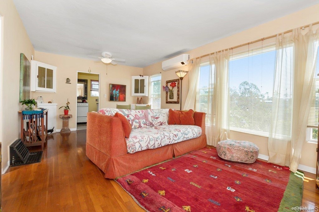 3023-3027 Olive Street San Diego, CA 92104 - Photo 2 of 41 Spacious combination living and dining room with hardwood floors and updated windows