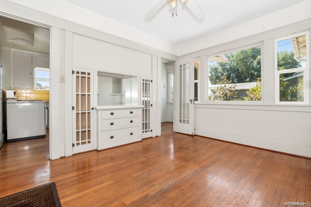 3023-3027 Olive Street San Diego, CA 92104 - Photo 26 of 41 Dining room features wood floors, a built-in buffet and cabinets