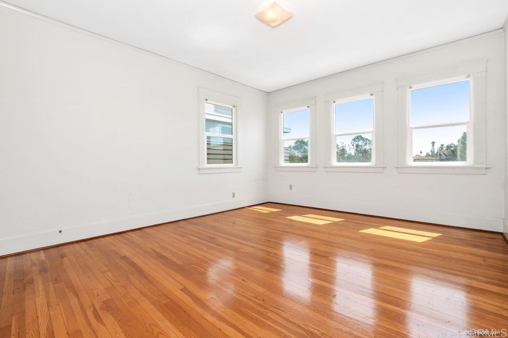 3023-3027 Olive Street San Diego, CA 92104 - Photo 33 of 41 Bedroom 1 with hardwood floors, overlooking Switzer Canyon