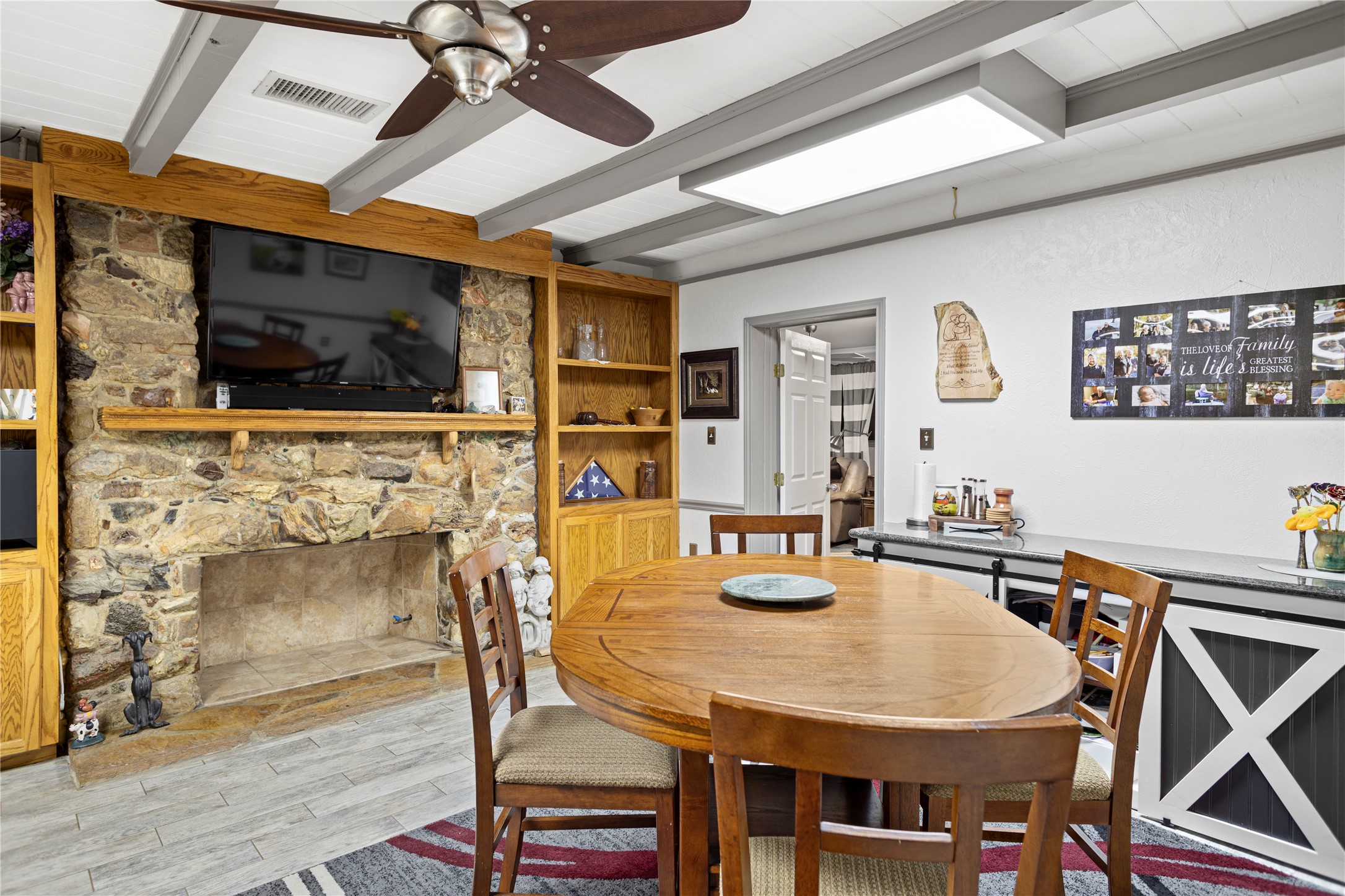 879 Interstate 45 Huntsville, TX 77340 - Photo 12 of 48 a view of a dining room with furniture and wooden floor