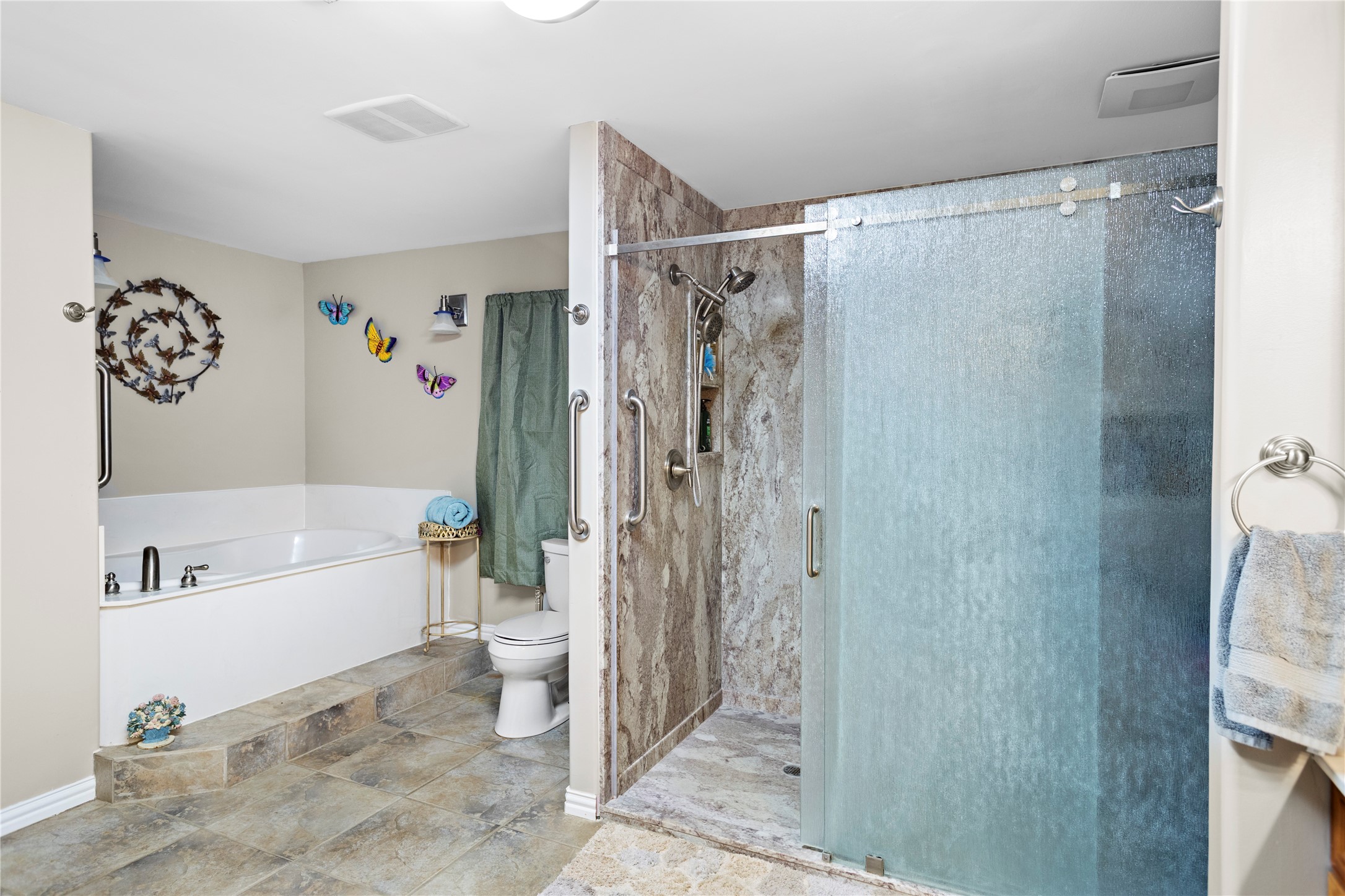 879 Interstate 45 Huntsville, TX 77340 - Photo 23 of 48 a bathroom with a bathtub and a shower
