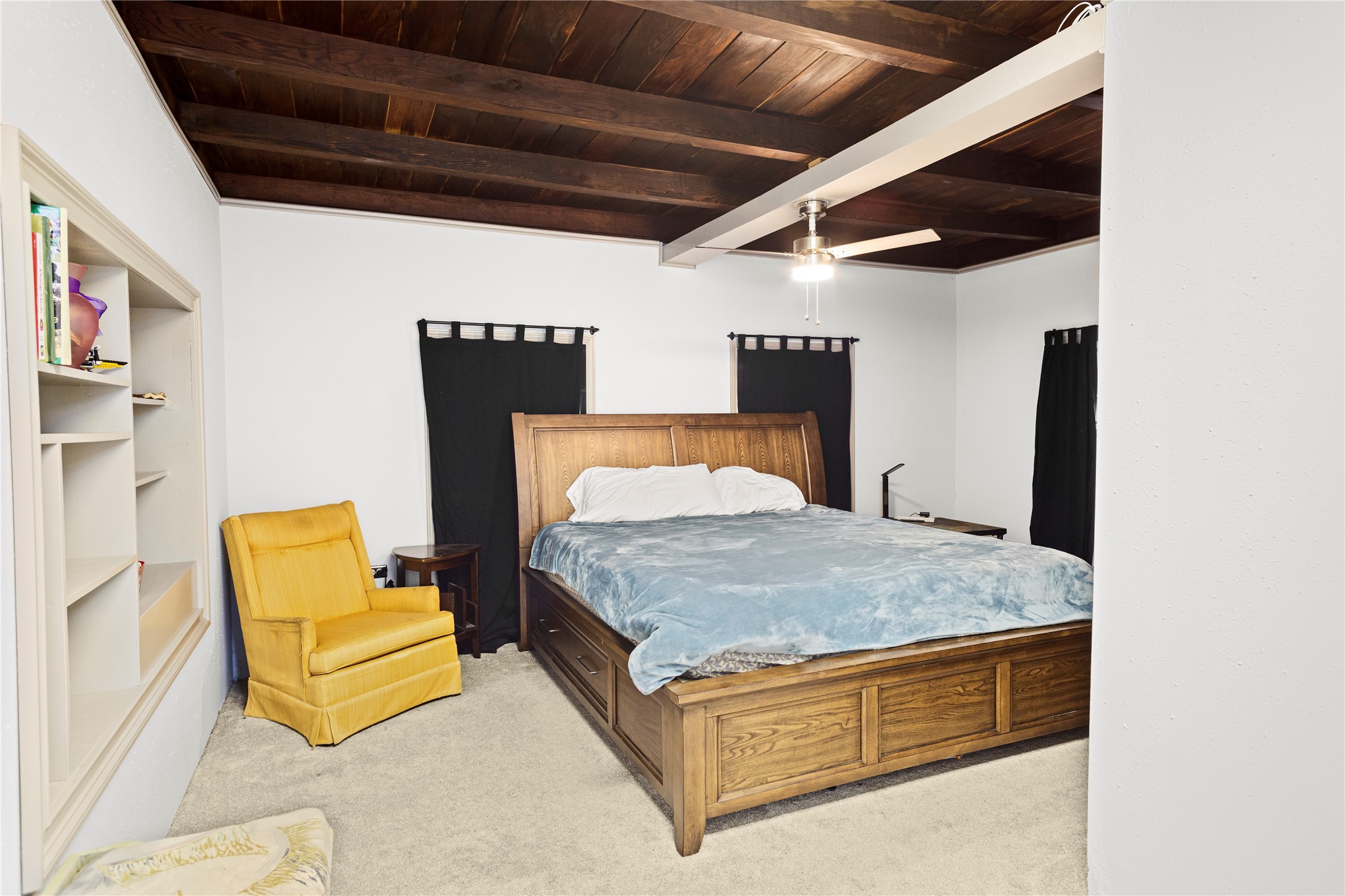 879 Interstate 45 Huntsville, TX 77340 - Photo 24 of 47 a room with bed and a couch