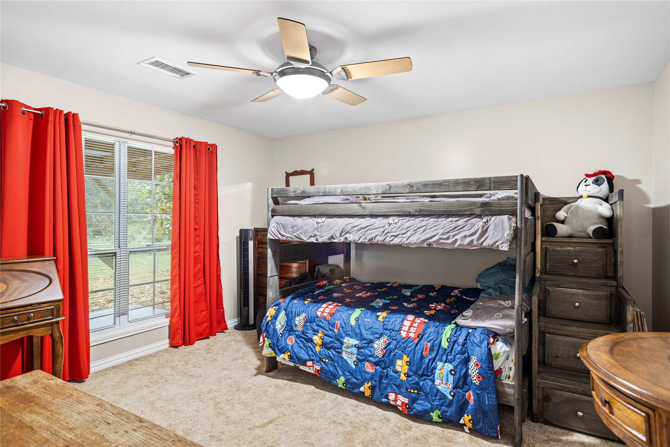 879 Interstate 45 Huntsville, TX 77340 - Photo 25 of 47 a bedroom with a bed and a tv