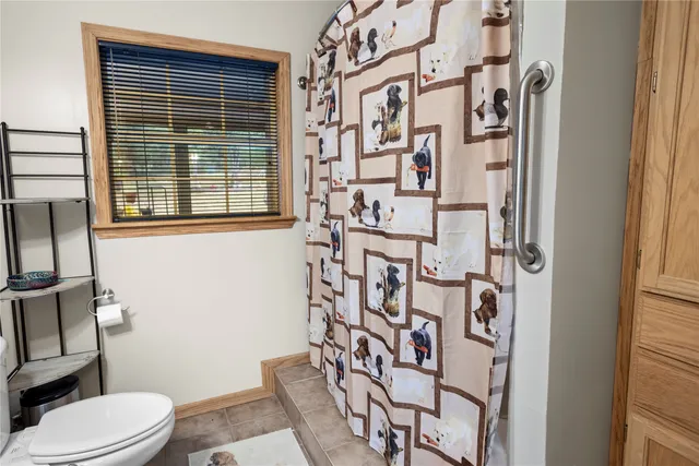 a white toilet sitting next to a bathroom sink