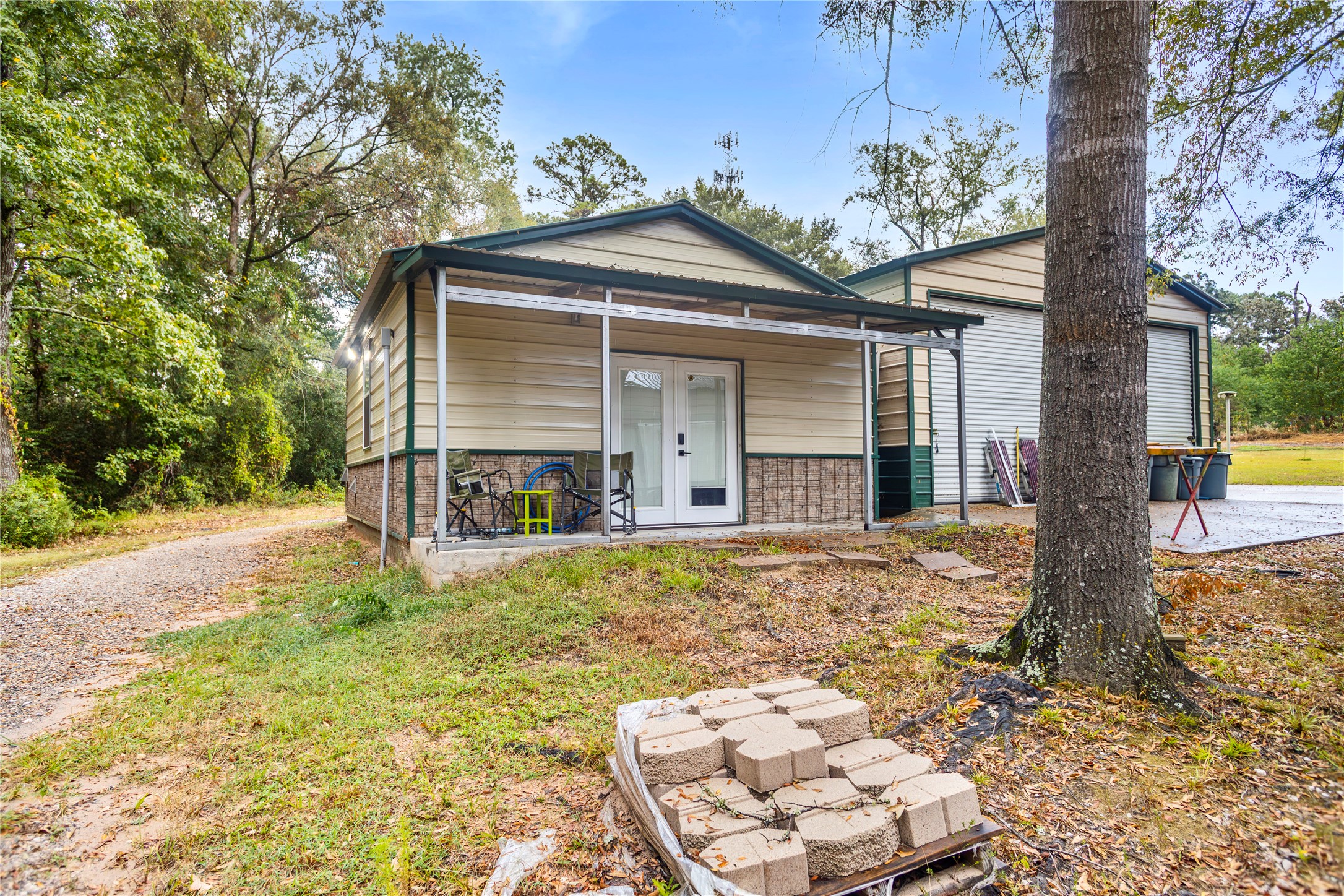 879 Interstate 45 Huntsville, TX 77340 - Photo 34 of 47 a front view of a house with a yard and garage