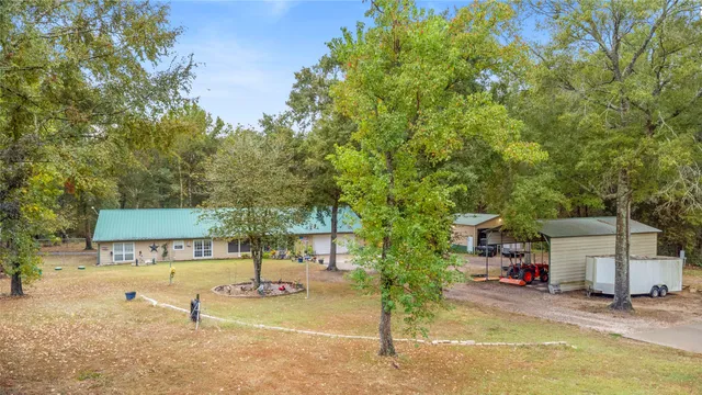 a view of a house with basketball court