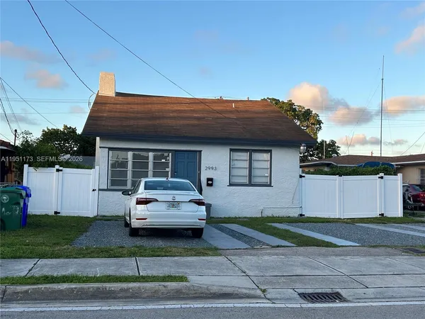a car parked in front of a house