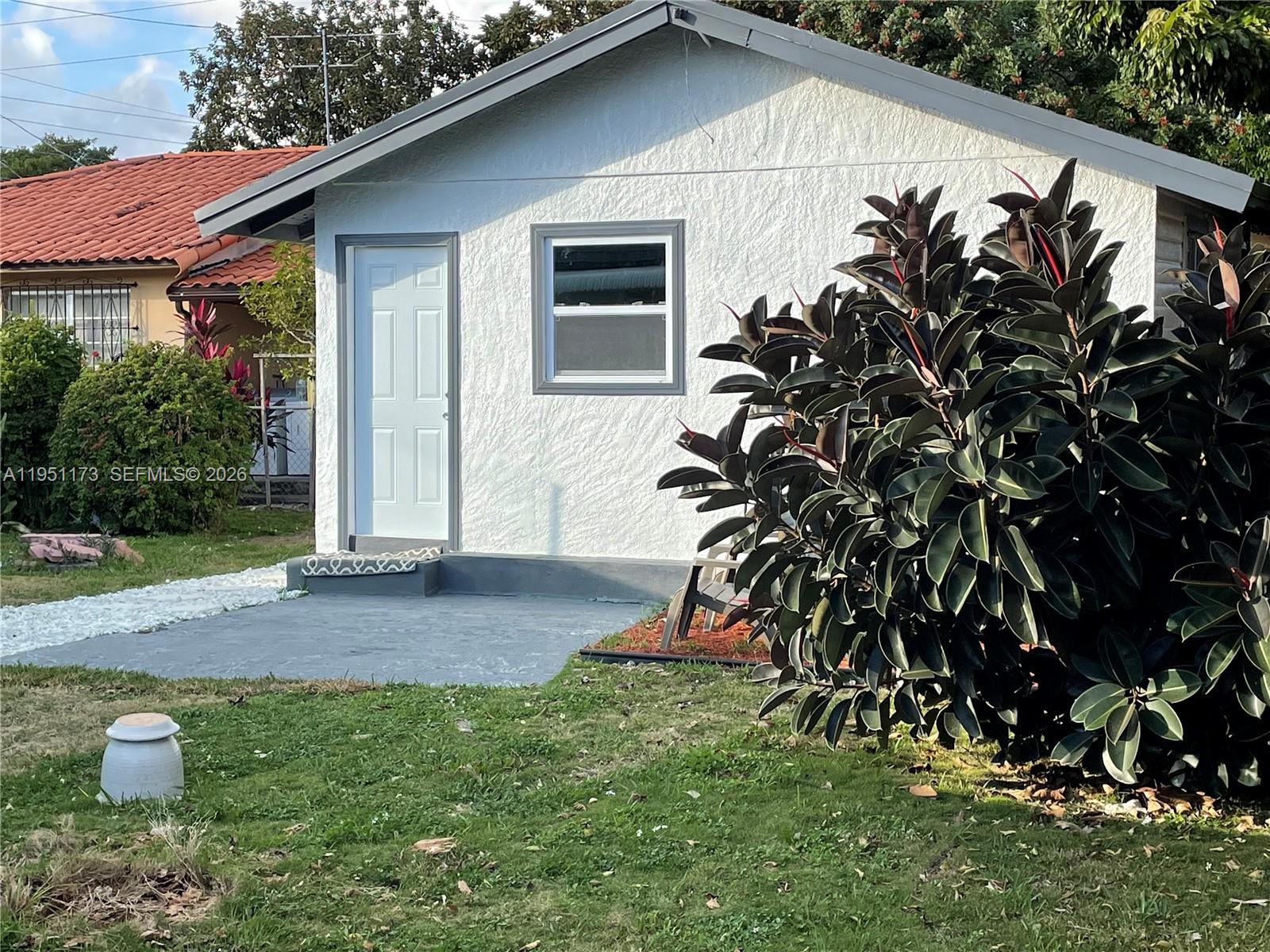 2993 Southwest 16th Terrace Miami, FL 33145 - Photo 12 of 17 a backyard of a house with lots of green space