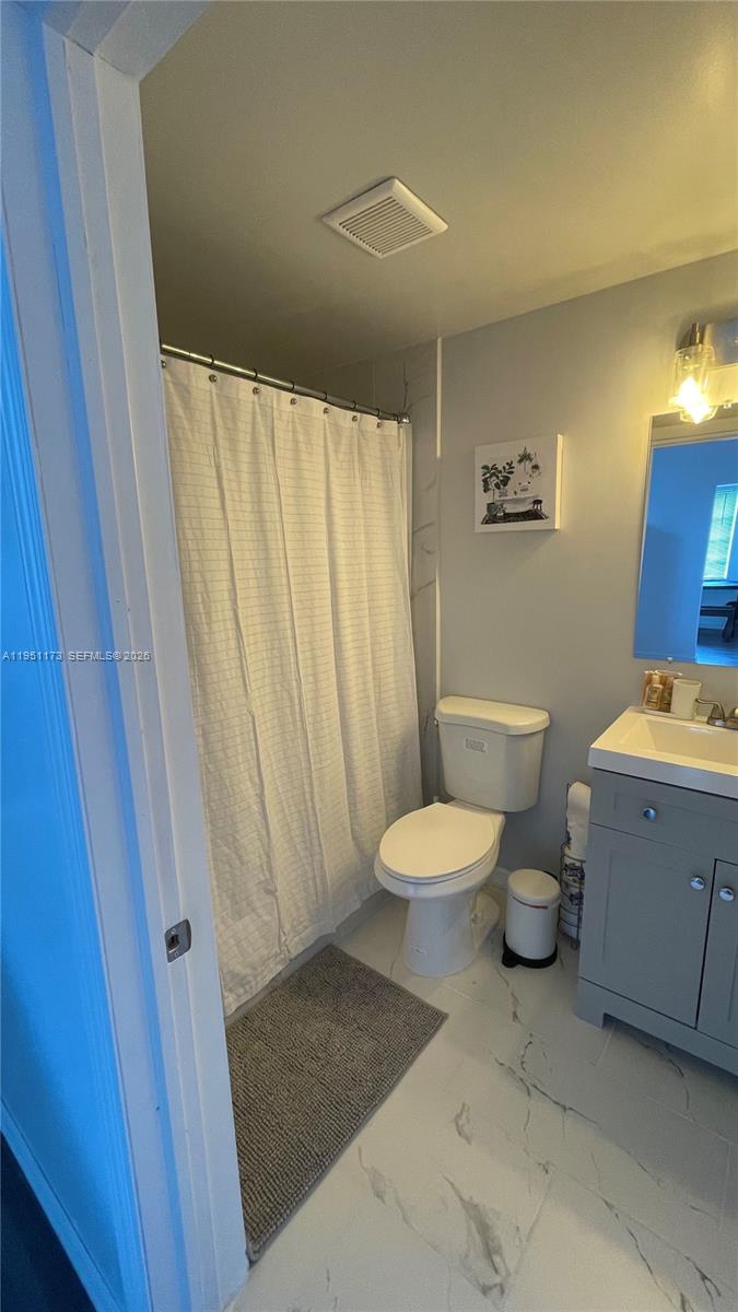 2993 Southwest 16th Terrace Miami, FL 33145 - Photo 13 of 17 a bathroom with a sink and a mirror