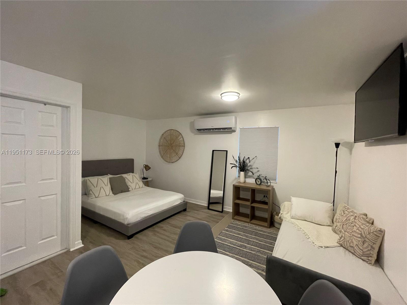 2993 Southwest 16th Terrace Miami, FL 33145 - Photo 14 of 17 a living room with furniture and a flat screen tv