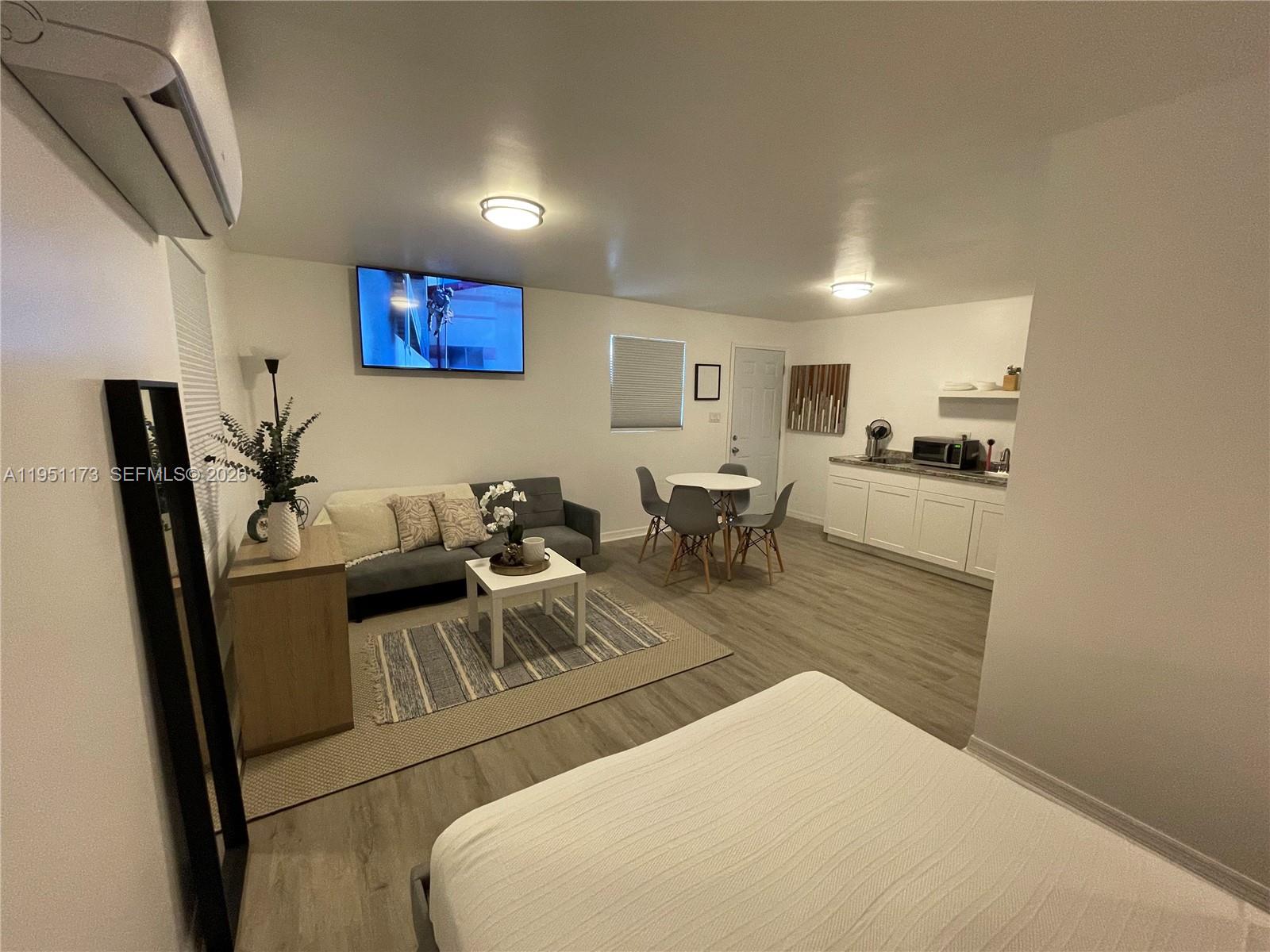 2993 Southwest 16th Terrace Miami, FL 33145 - Photo 15 of 17 a living room with furniture and a flat screen tv