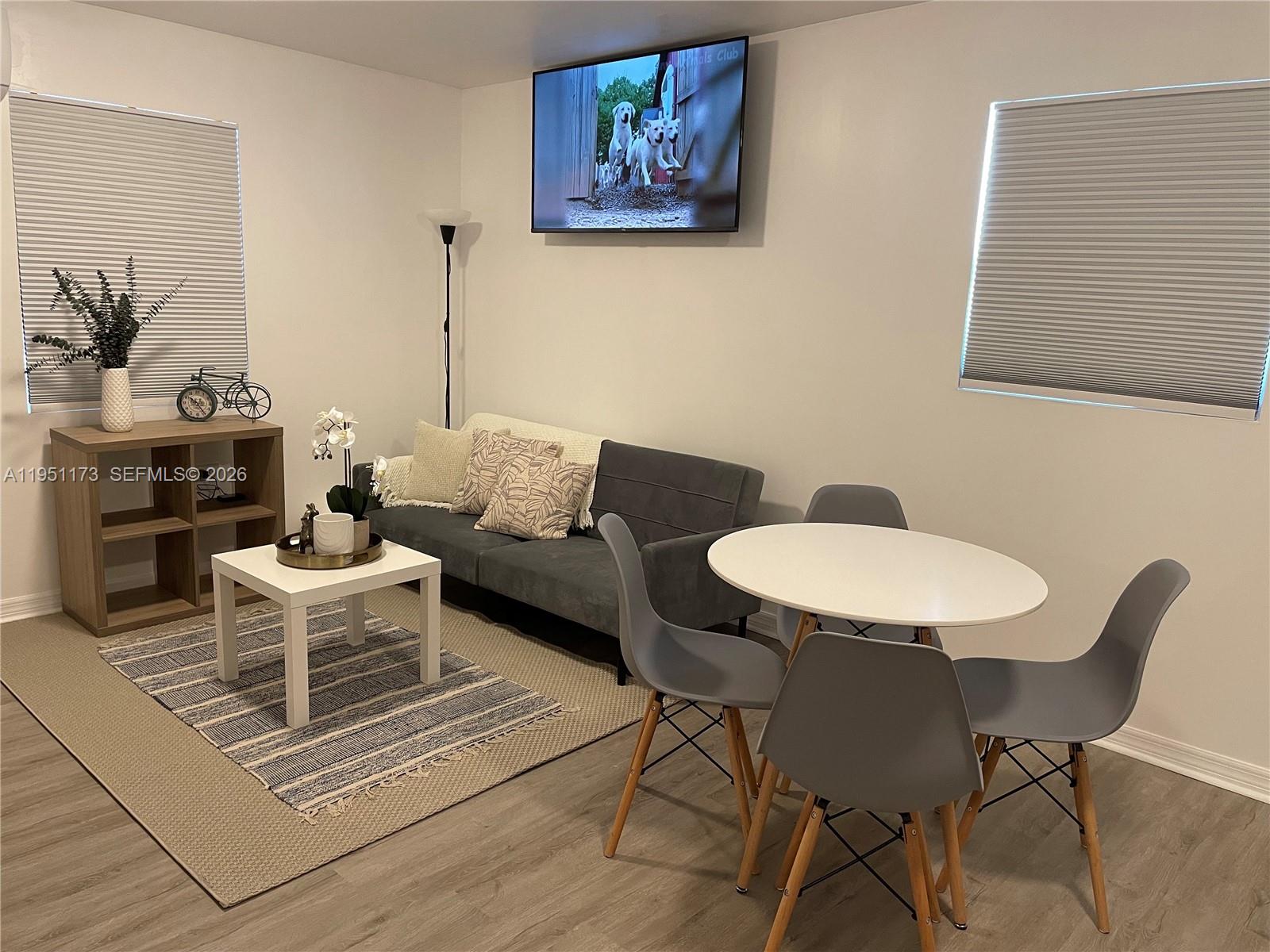 2993 Southwest 16th Terrace Miami, FL 33145 - Photo 16 of 17 a living room with furniture and a table