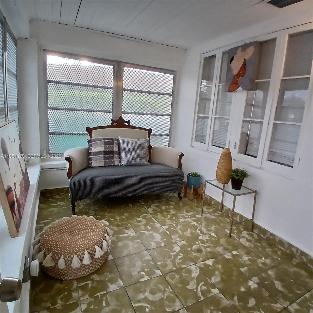 2993 Southwest 16th Terrace Miami, FL 33145 - Photo 2 of 17 a living room with furniture and a potted plant