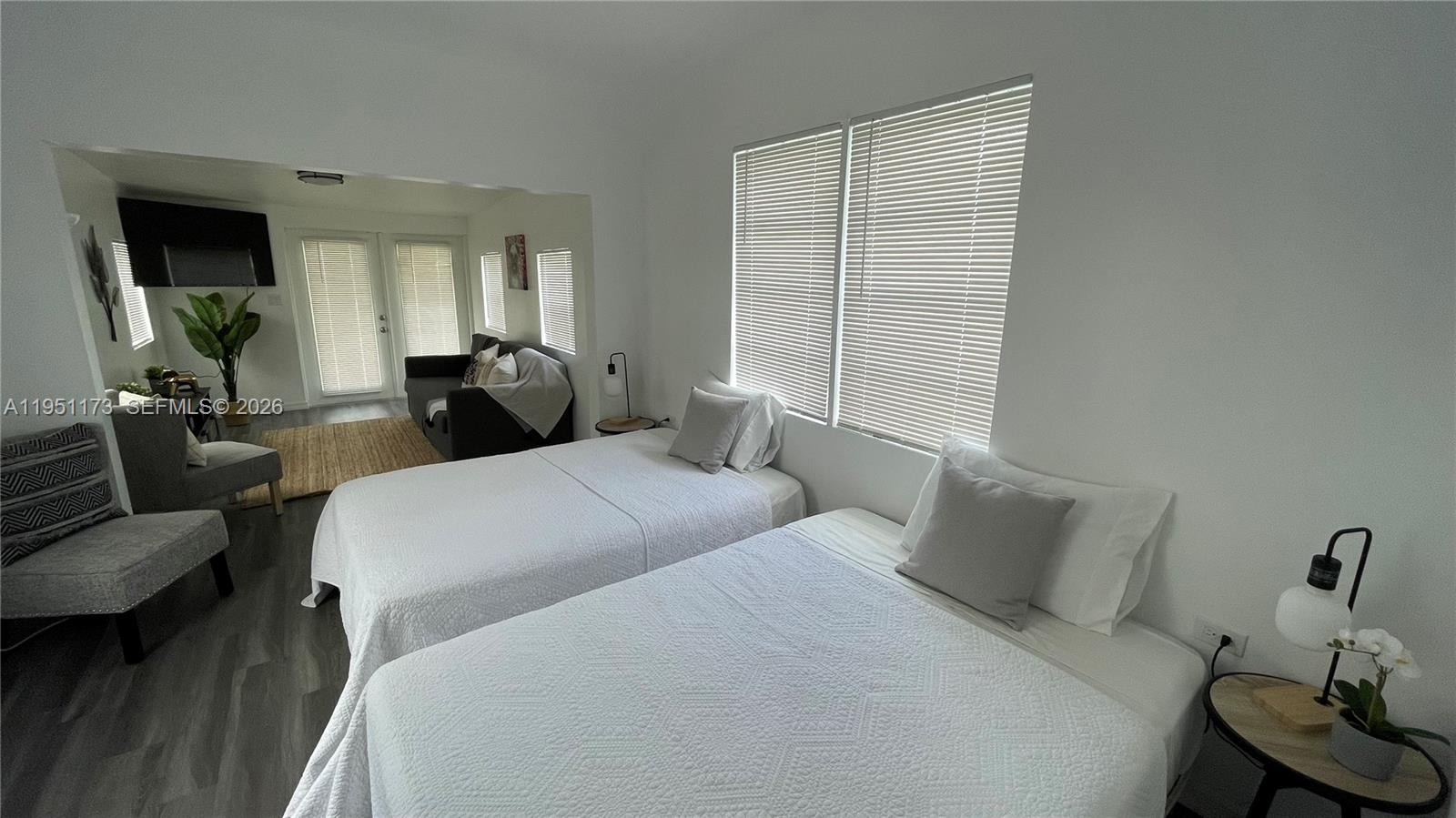 2993 Southwest 16th Terrace Miami, FL 33145 - Photo 10 of 17 a bedroom with bed and wooden floor