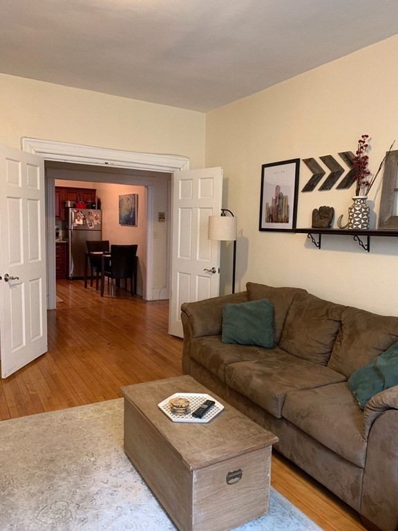 16 Royce Road, Unit 5 Boston, MA 02134 - Photo 10 of 10 a living room with furniture and a couch