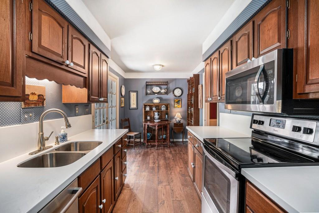 1484 Leafmore Place Decatur, GA 30033 - Photo 11 of 33 a kitchen with a sink stove and cabinets