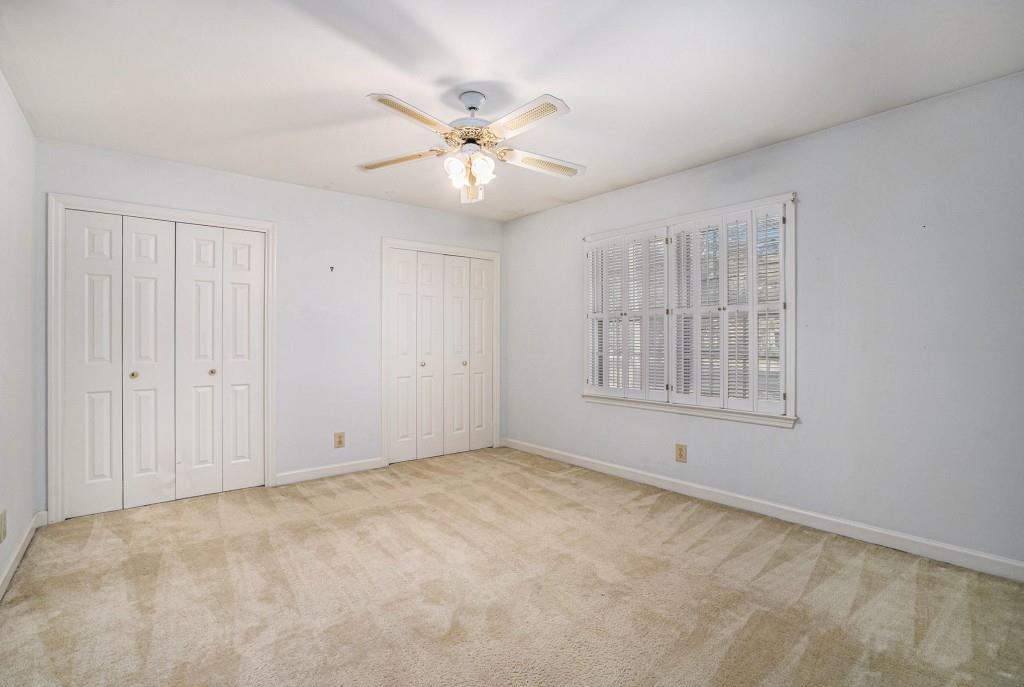 1484 Leafmore Place Decatur, GA 30033 - Photo 20 of 33 an empty room with windows and fan