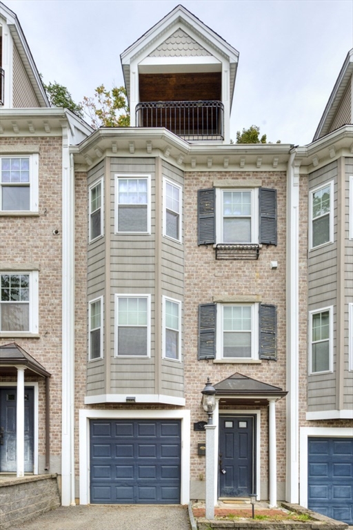 a view of a brick building with large windows