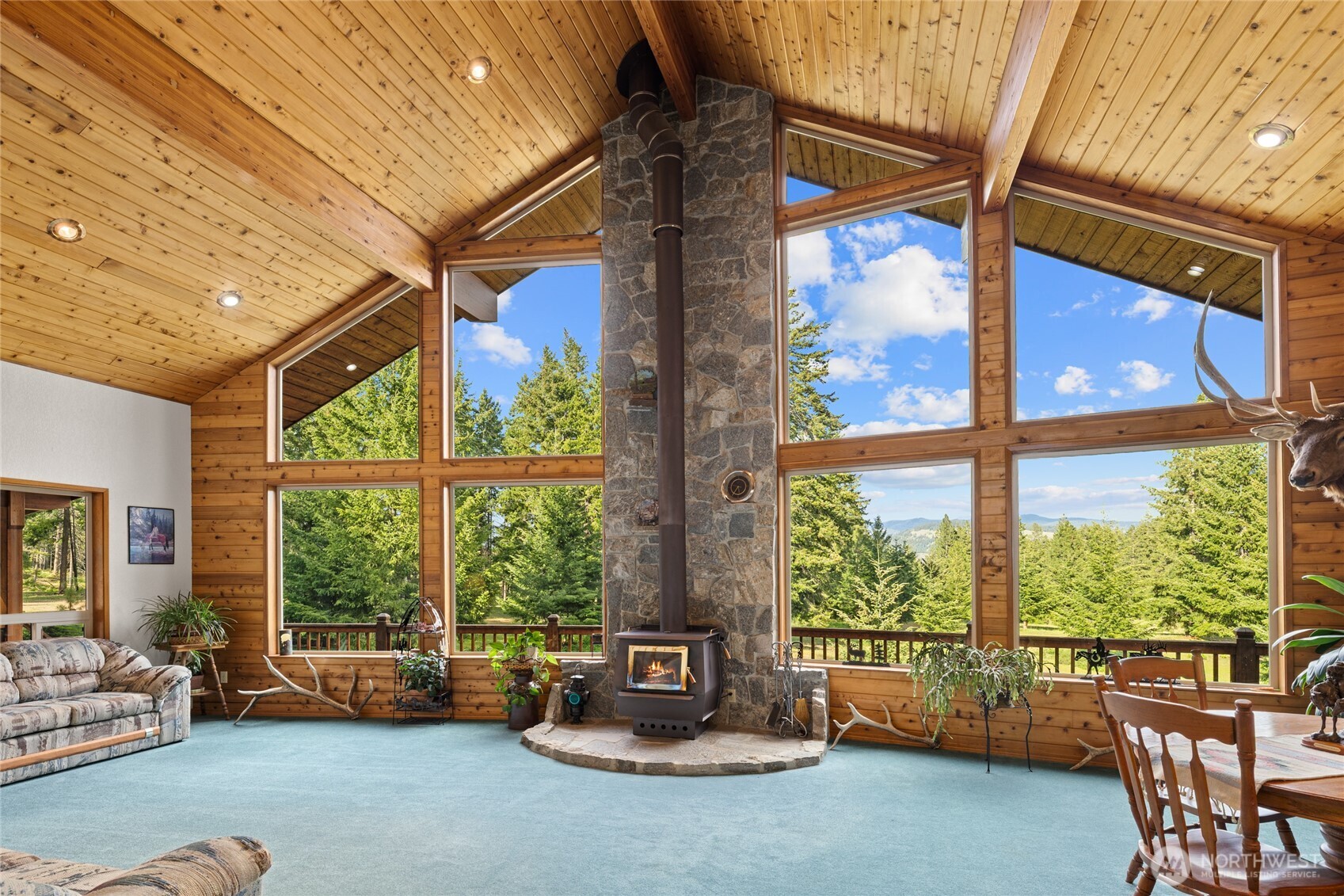1101 Emerick Road Cle Elum, WA 98922 - Photo 20 of 40 a room with furniture and floor to ceiling windows
