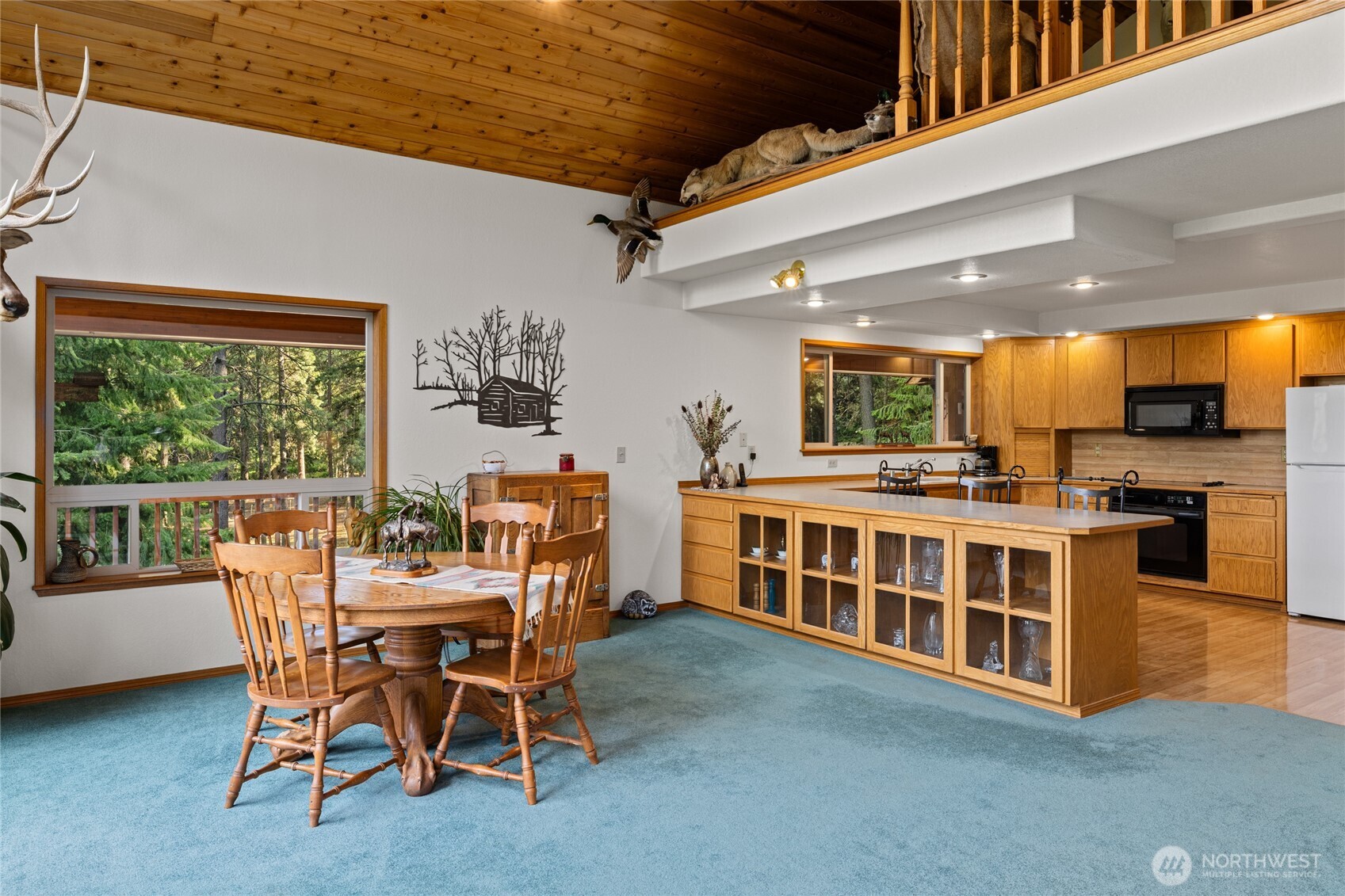 1101 Emerick Road Cle Elum, WA 98922 - Photo 23 of 40 a dining room with furniture and a floor to ceiling window