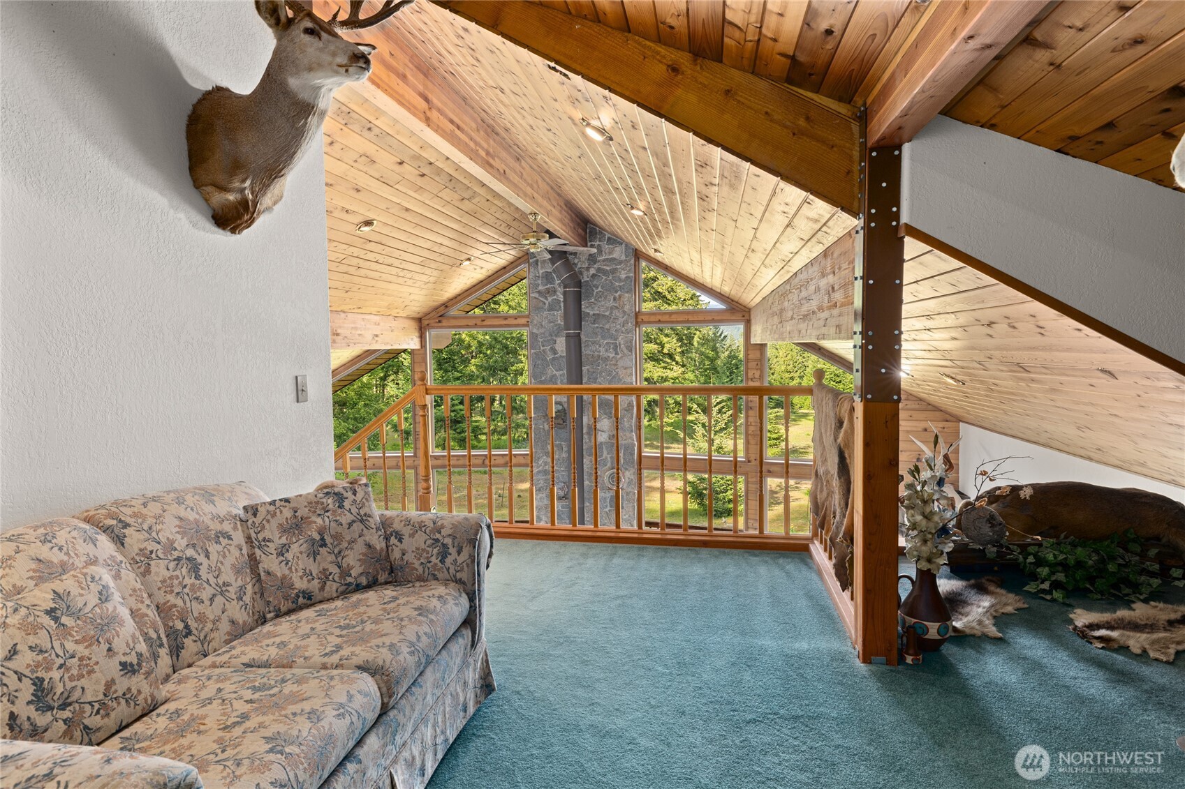1101 Emerick Road Cle Elum, WA 98922 - Photo 26 of 40 a living room with furniture and a floor to ceiling window