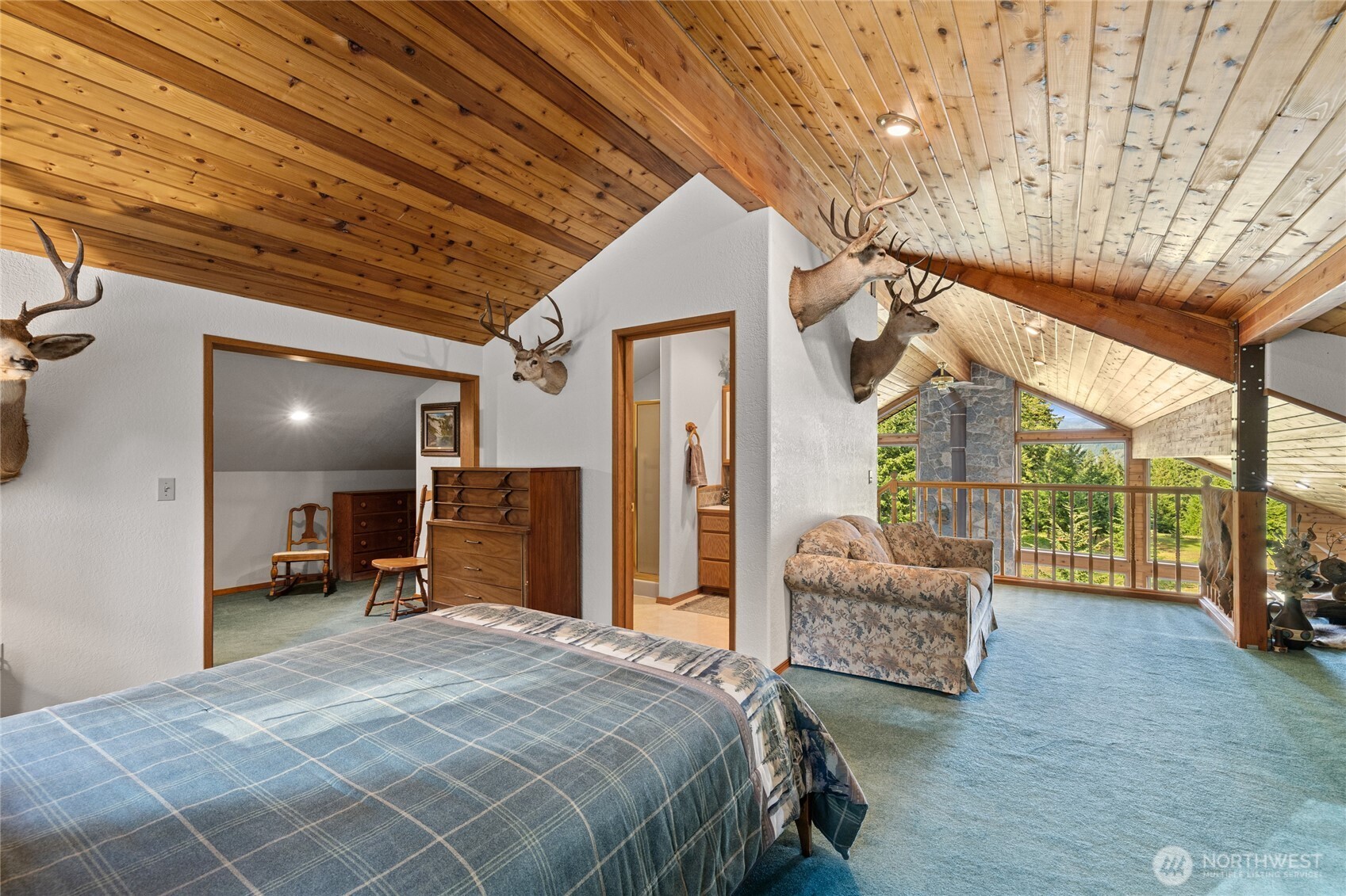 1101 Emerick Road Cle Elum, WA 98922 - Photo 27 of 40 a bedroom with furniture and a large window