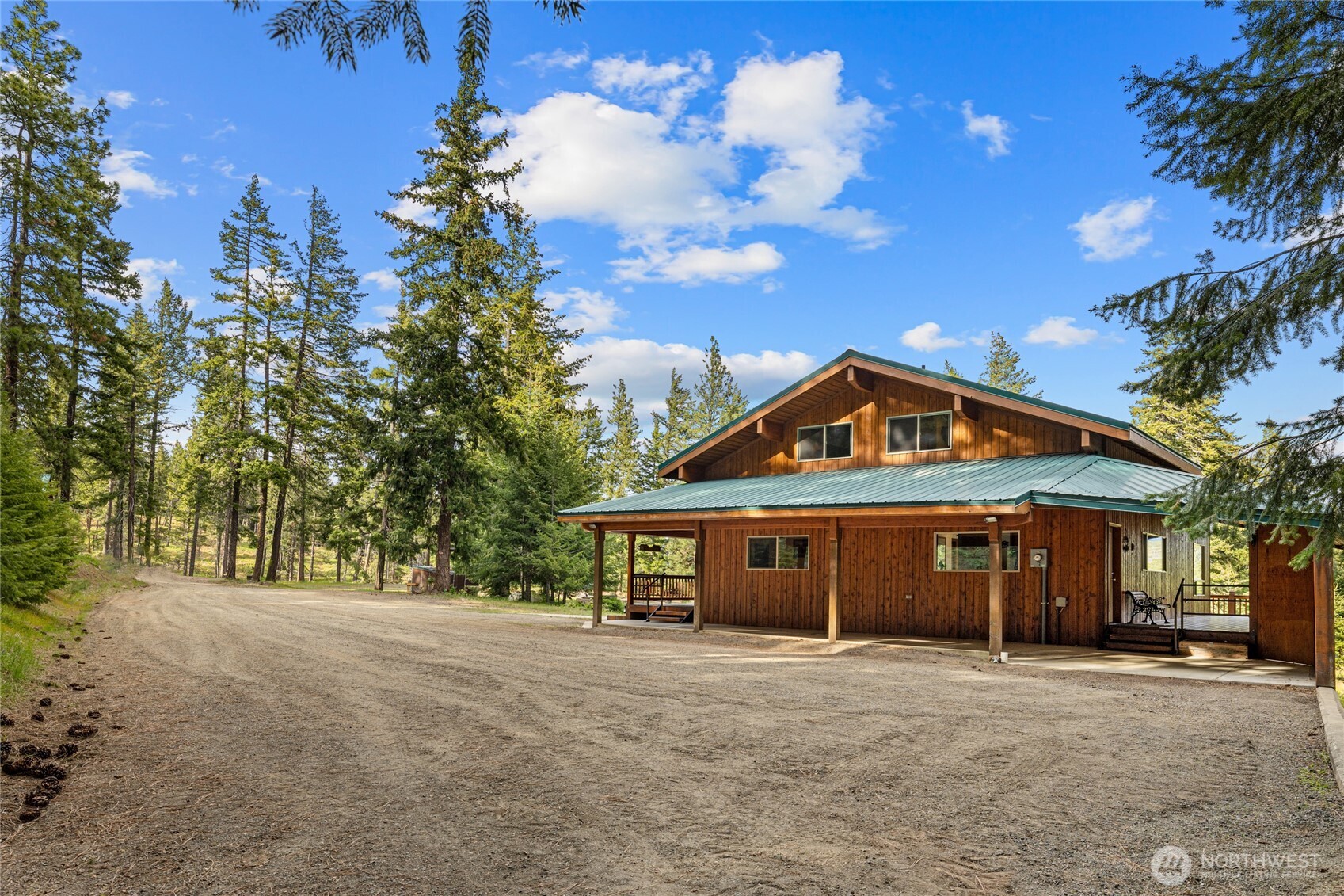 1101 Emerick Road Cle Elum, WA 98922 - Photo 7 of 40 a front view of a house with a yard and garage