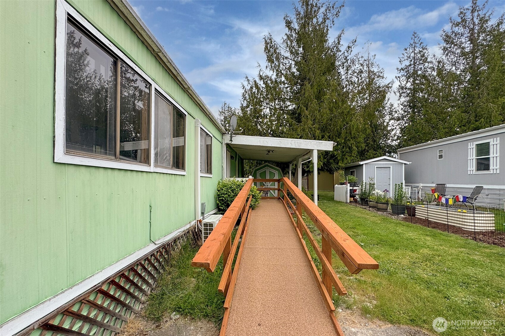 90 Baywood Village Road, Unit 34 Sequim, WA 98382 - Photo 35 of 40 a view of house with backyard and deck