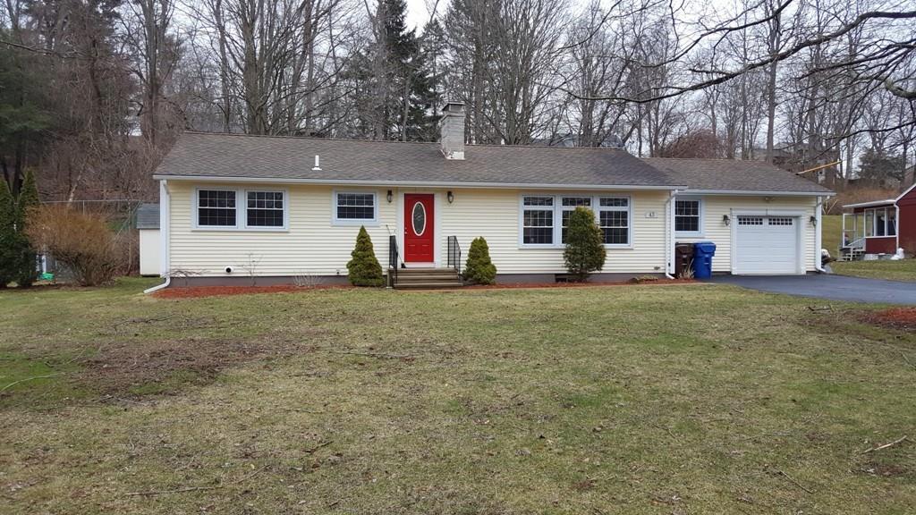 43 Lake Road North Branford, CT 06471 - Photo 1 of 1 a front view of house with yard and trees around