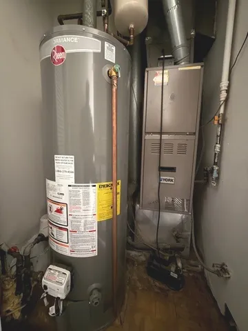 a bathroom with a refrigerator and washer