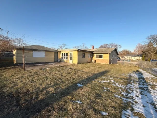 a big house with a big yard and large trees