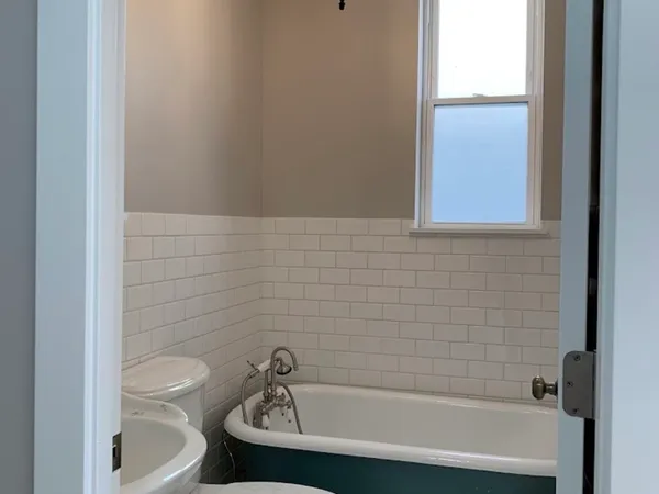 a bathroom with a shower curtain and sink
