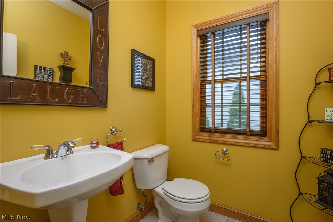 806 Forrest Ridge Drive Dover, OH 44622 - Photo 20 of 36 Half bath featuring toilet and baseboards