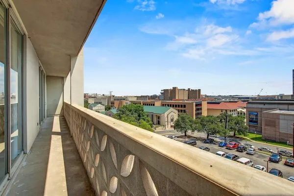 a view of a balcony with city view