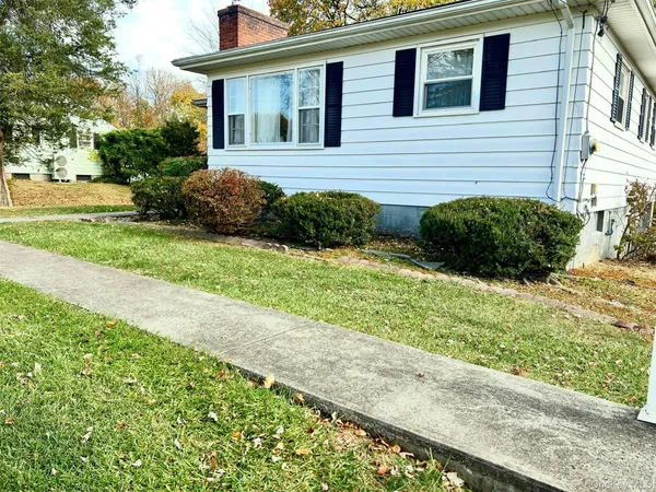 a view of a kitchen with a sink and a refrigerator
