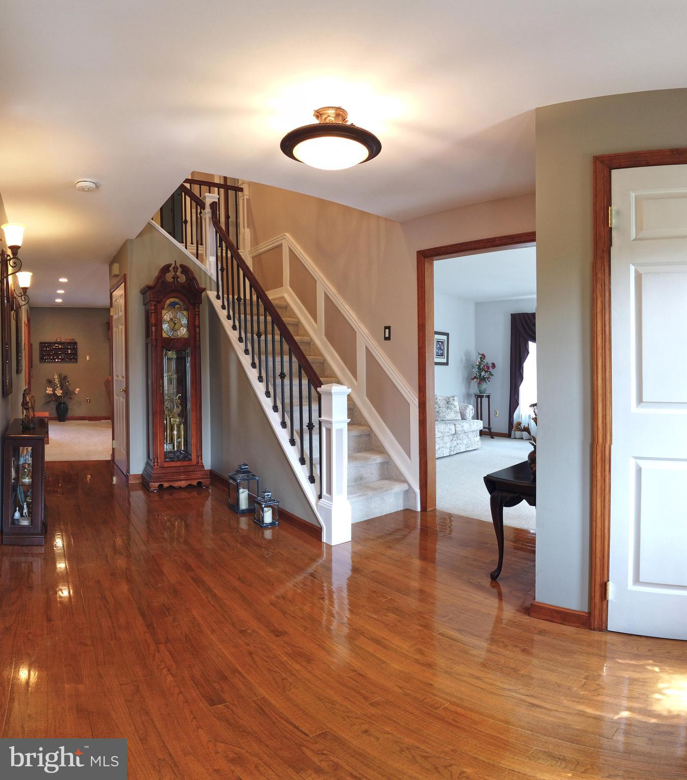 103 Fox Chase Court Southampton, NJ 08088 - Photo 12 of 98 a view of a hallway with wooden floor and a dining room