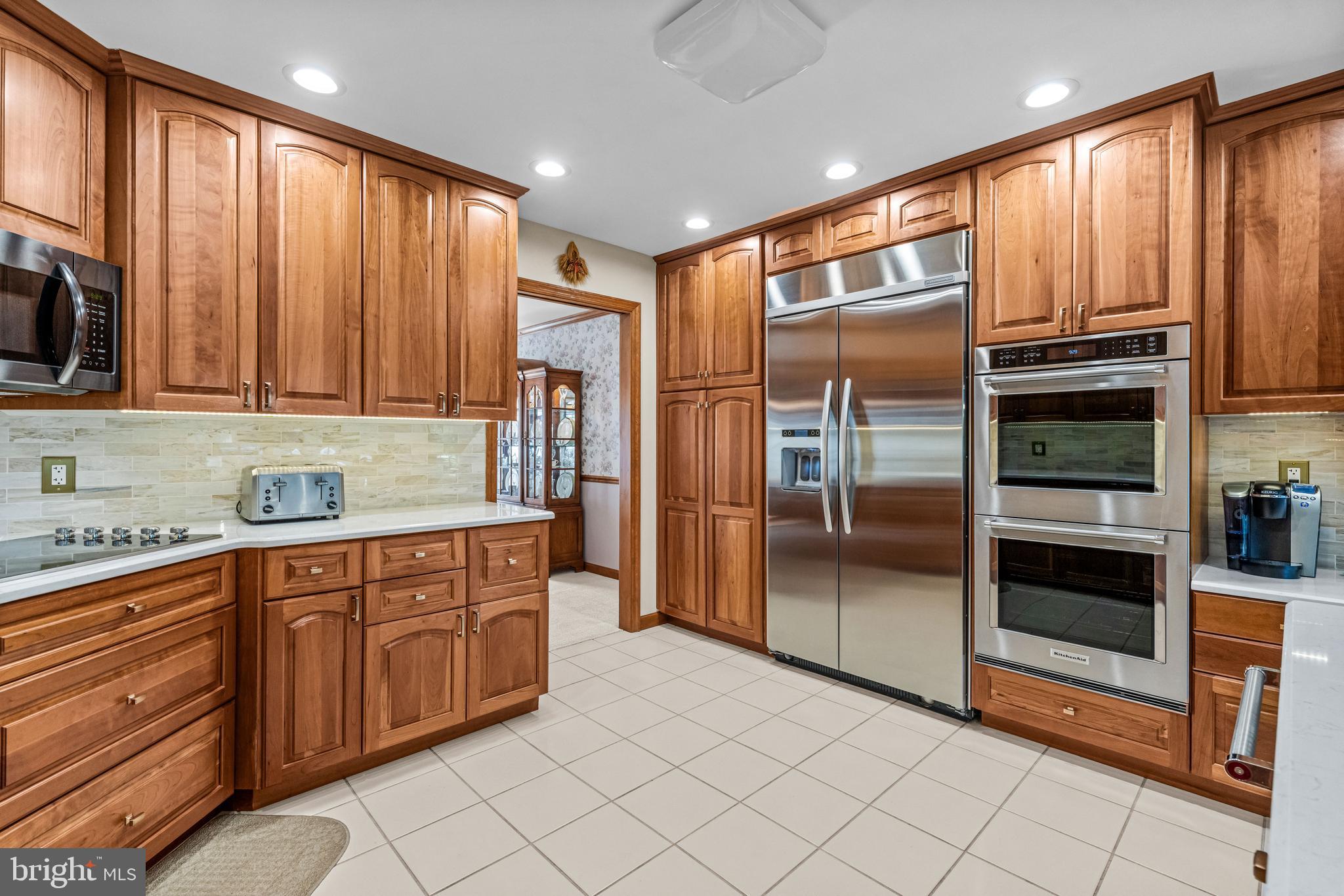 103 Fox Chase Court Southampton, NJ 08088 - Photo 29 of 98 a kitchen with stainless steel appliances granite countertop a refrigerator and a stove top oven