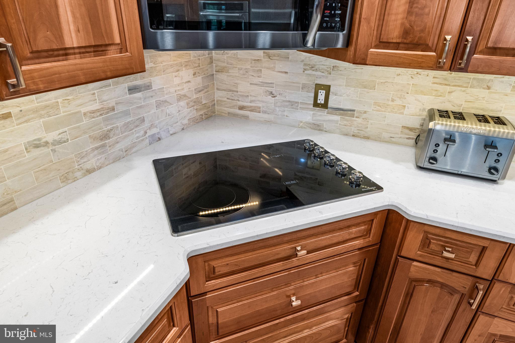 103 Fox Chase Court Southampton, NJ 08088 - Photo 30 of 98 a kitchen with granite countertop white cabinets and stainless steel appliances