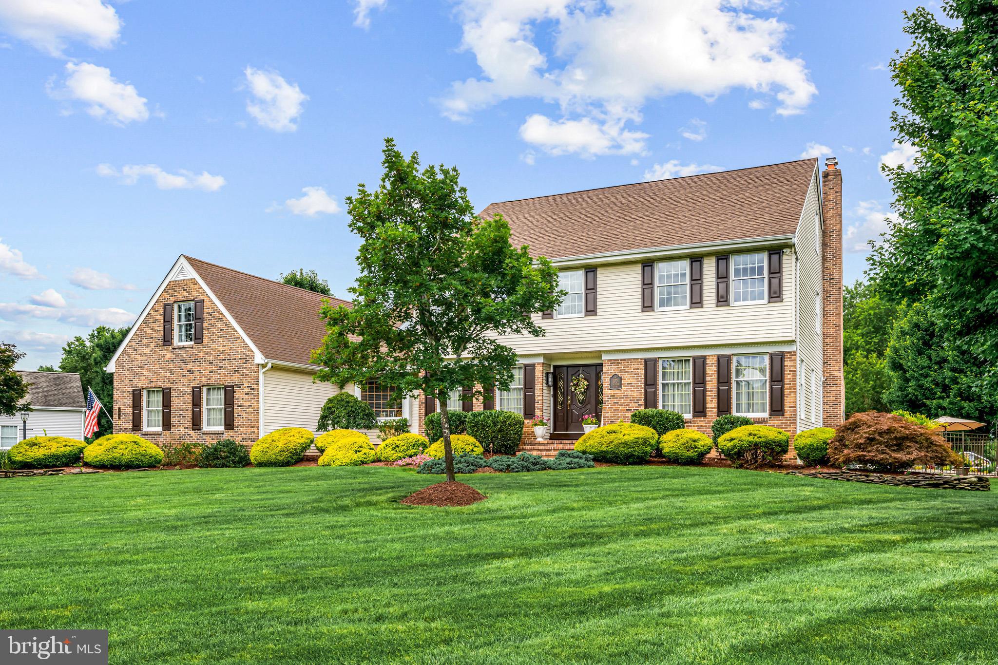 103 Fox Chase Court Southampton, NJ 08088 - Photo 3 of 98 a front view of a house with garden and trees