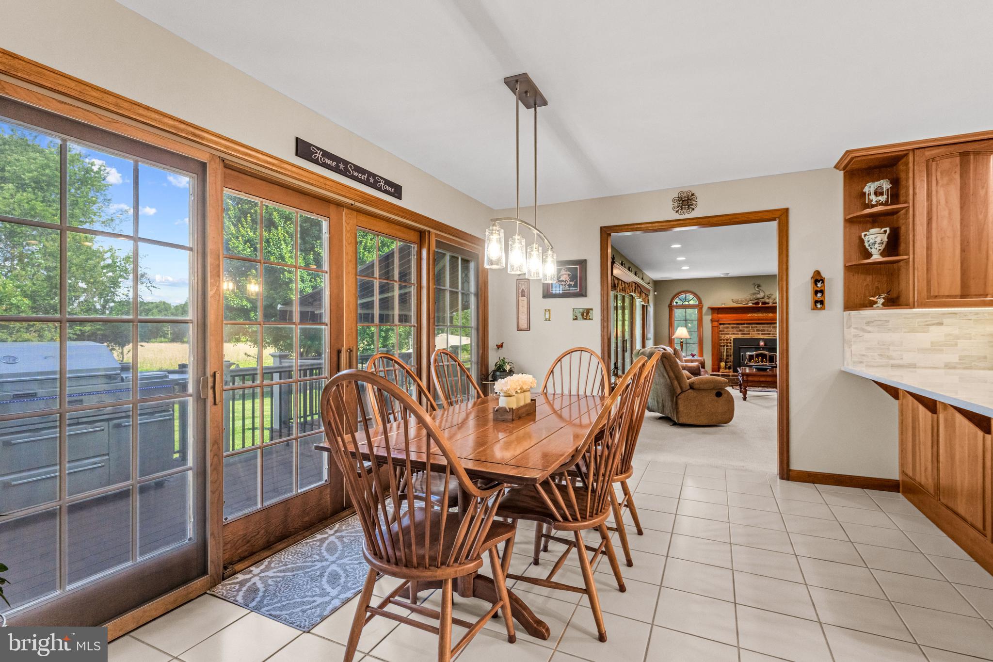 103 Fox Chase Court Southampton, NJ 08088 - Photo 32 of 98 a dining room with furniture a chandelier and fireplace