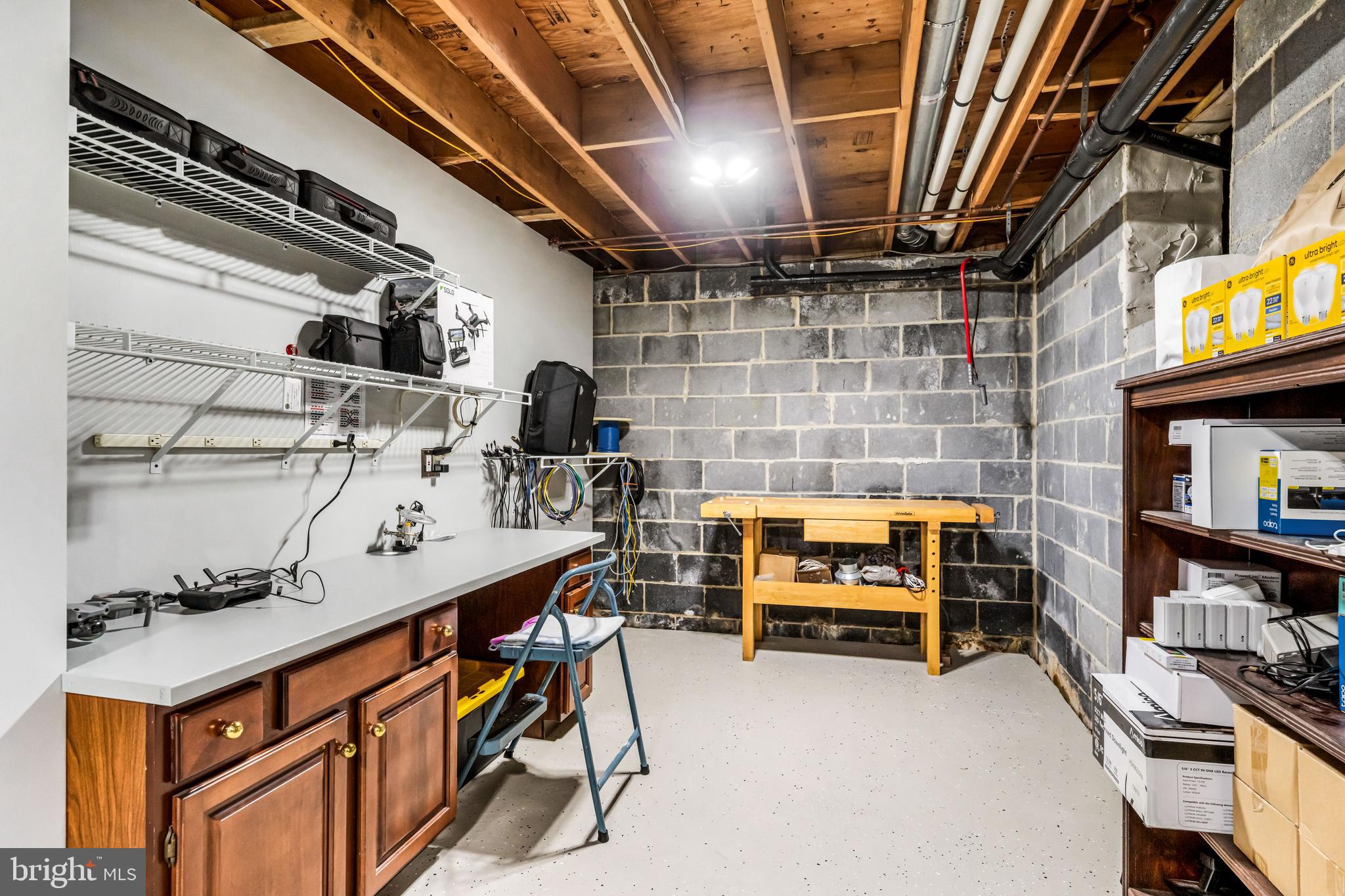 103 Fox Chase Court Southampton, NJ 08088 - Photo 72 of 98 a storage room with furniture and a flat screen tv