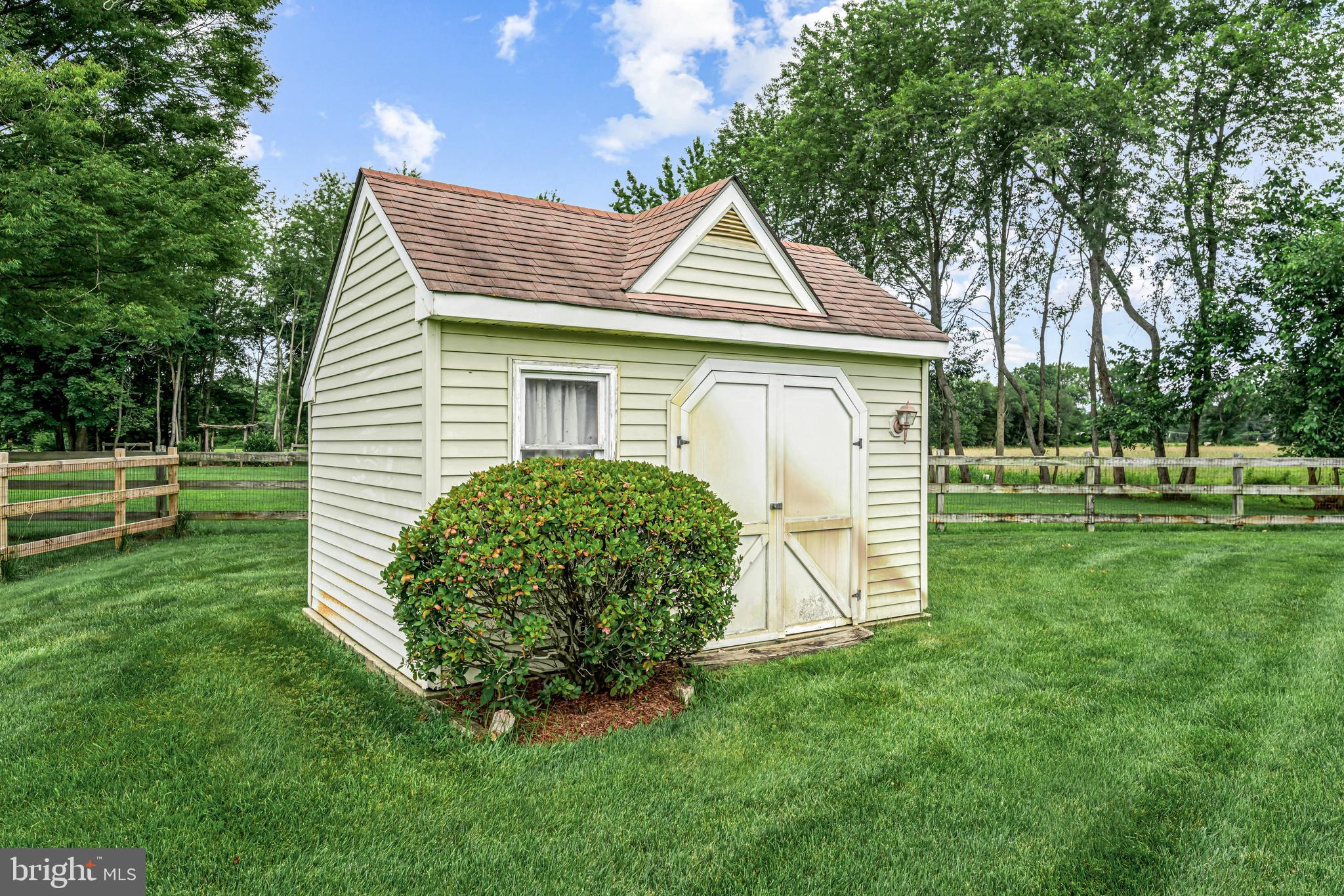 103 Fox Chase Court Southampton, NJ 08088 - Photo 82 of 98 a view of a white house with a small yard and large trees
