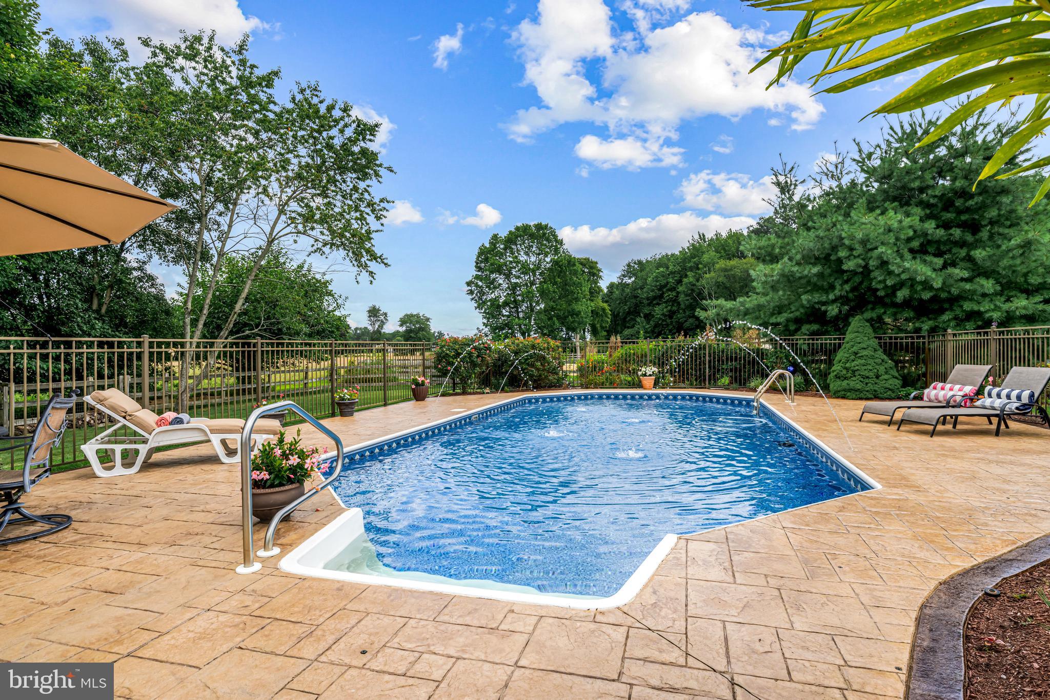 103 Fox Chase Court Southampton, NJ 08088 - Photo 88 of 98 a view of a swimming pool with a lounge chair