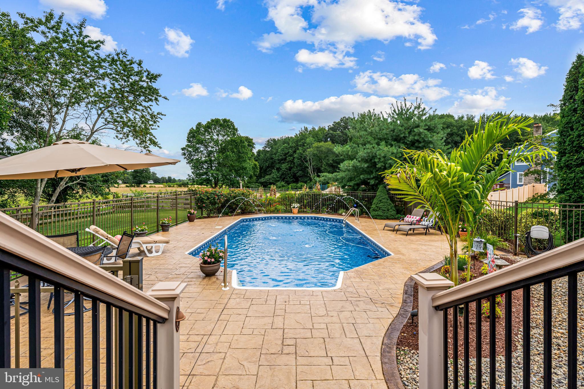 103 Fox Chase Court Southampton, NJ 08088 - Photo 95 of 98 a view of a swimming pool with a patio and yard