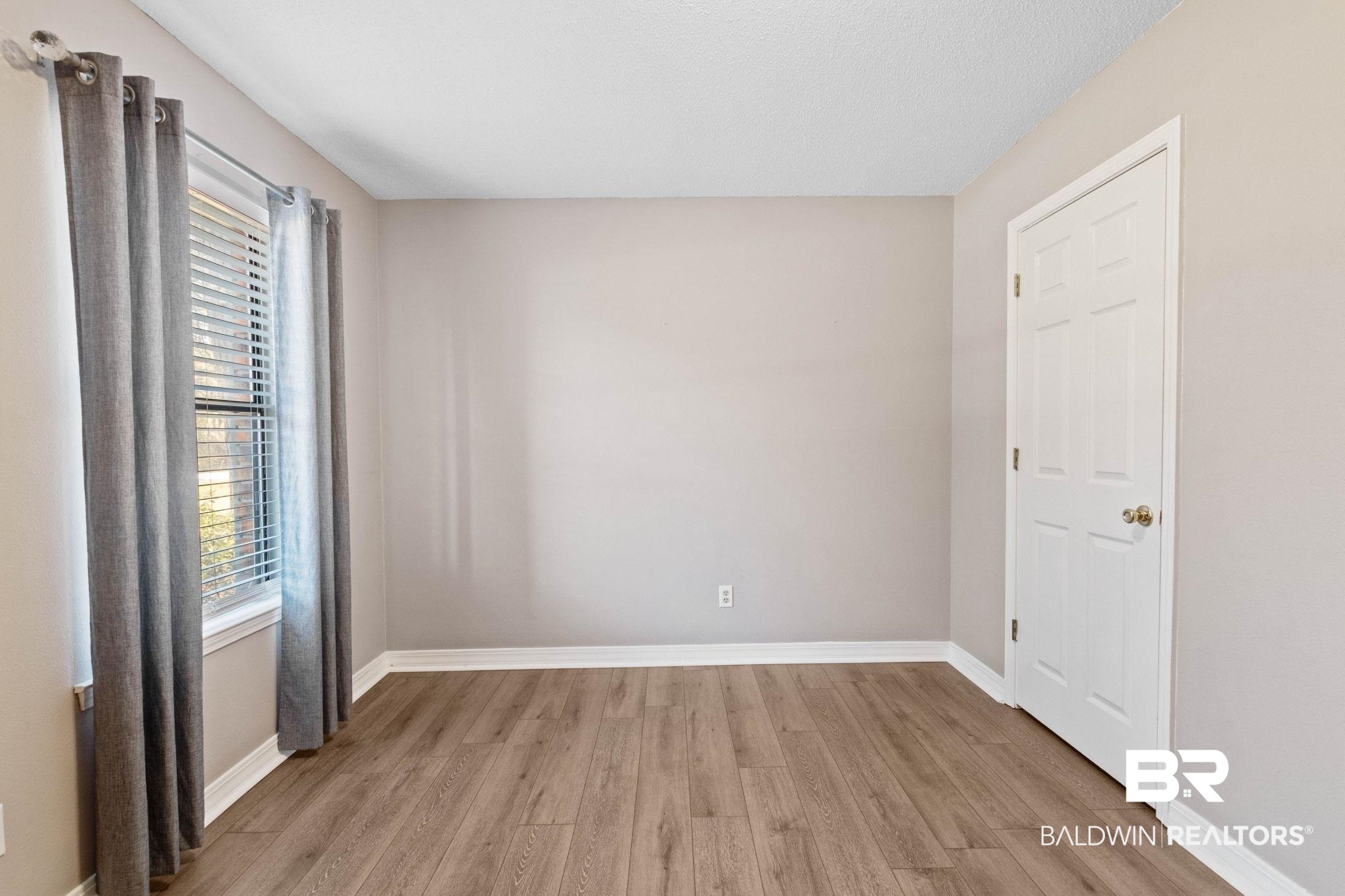 5366 Scanlan Way West Satsuma, AL 36572 - Photo 19 of 43 Spare room with light wood-style flooring and baseboards