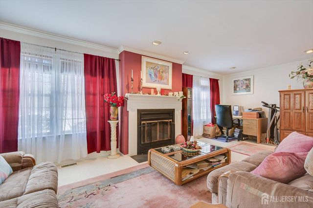 a living room with furniture a rug and a window