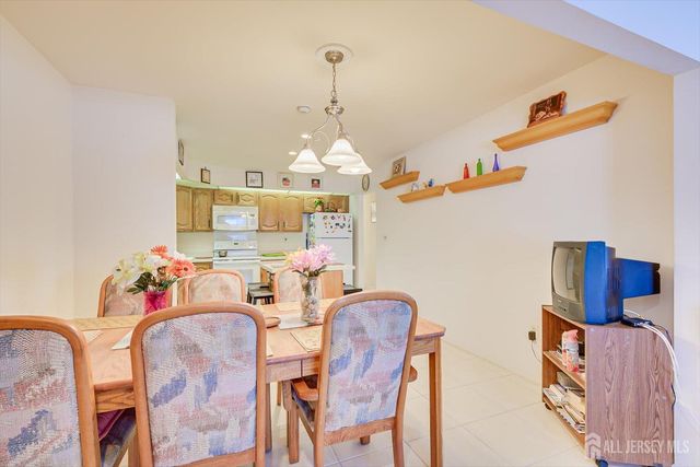 a kitchen with stainless steel appliances a refrigerator and a sink