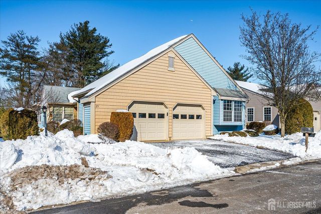 a view of a white house covered in snow